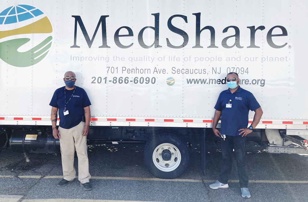 Charles Thompson (left) and Kishen Douragh, Penn Medicine Princeton health, deliver donated PPE and supplies to Medshare, an international emergency relief organization in Secaucus, N.J.